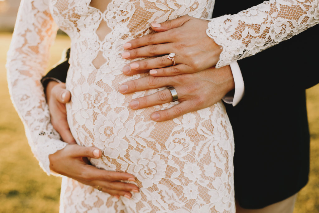 Long Beach California Wedding couple's hands on bride's pregnant tummy