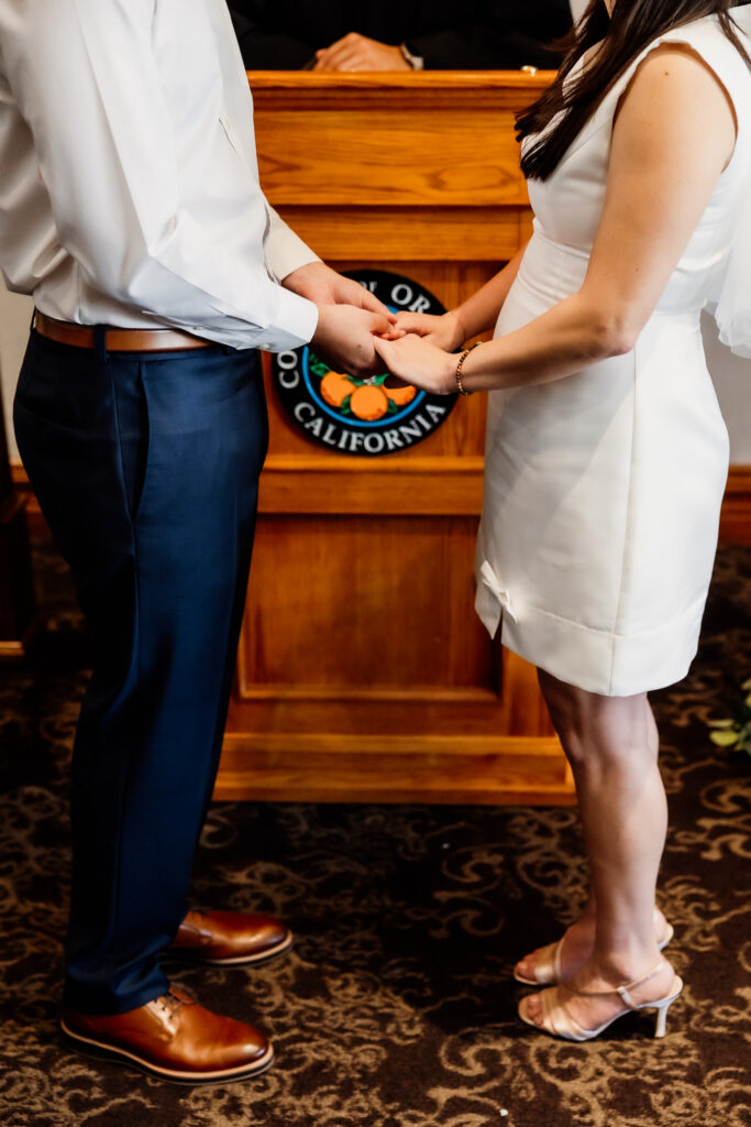 A complete guide to getting married at the Old Orange County Courthouse in Santa Ana, including licenses, ceremony details, guest limits, and photography tips.